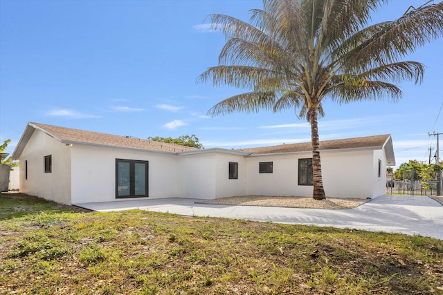 20685 NE 2nd Ave, Miami, FL 33179 - back of house featuring a patio area, stucco siding, french doors, and fence