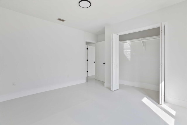 20685 NE 2nd Ave, Miami, FL 33179 - unfurnished bedroom with a closet, concrete floors, and visible vents