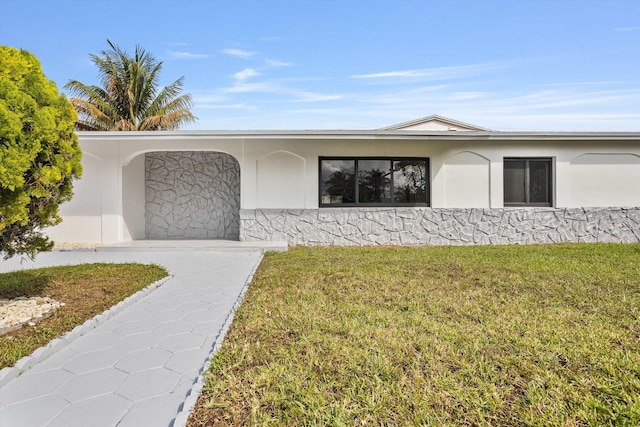 20685 NE 2nd Ave, Miami, FL 33179 - view of front of house with a front lawn and stucco siding