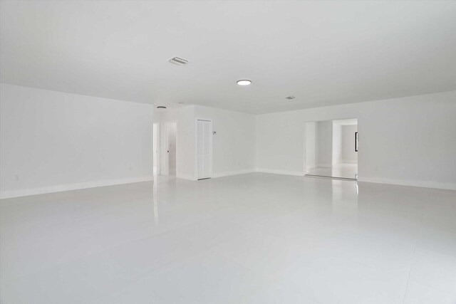 20685 NE 2nd Ave, Miami, FL 33179 - spare room featuring baseboards and visible vents