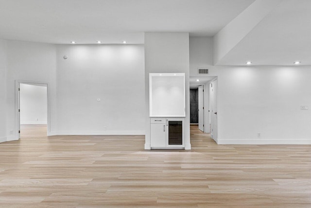 15687 Loch Maree Ln Unit 2404, Delray Beach, FL 33446 - unfurnished living room with light wood-type flooring, baseboards, recessed lighting, and a high ceiling