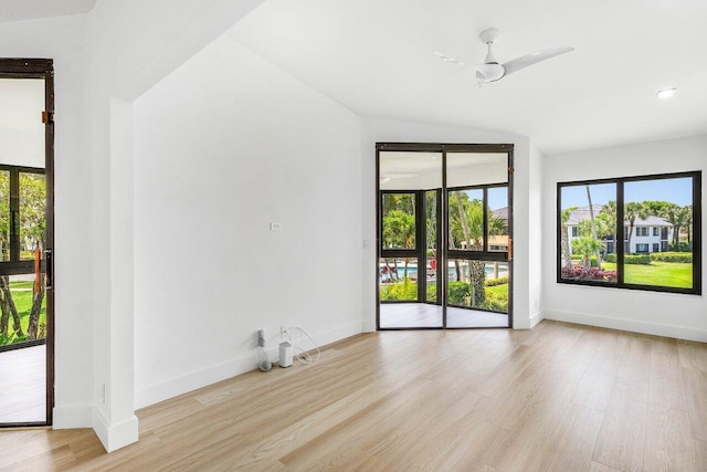 15687 Loch Maree Ln Unit 2404, Delray Beach, FL 33446 - spare room with wood finished floors, healthy amount of natural light, and baseboards