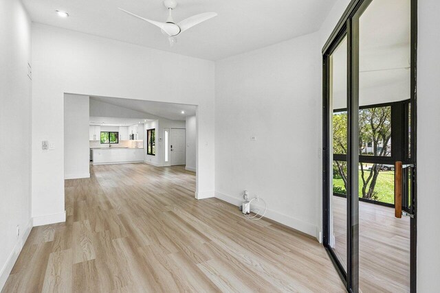 15687 Loch Maree Ln Unit 2404, Delray Beach, FL 33446 - unfurnished room with light wood-style flooring, a ceiling fan, and baseboards