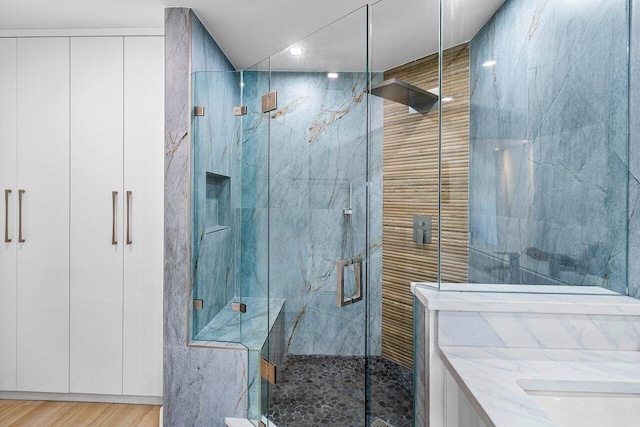 15687 Loch Maree Ln Unit 2404, Delray Beach, FL 33446 - full bathroom featuring a marble finish shower, wood finished floors, and recessed lighting