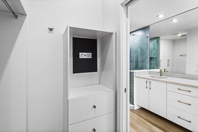 15687 Loch Maree Ln Unit 2404, Delray Beach, FL 33446 - bathroom with wood finished floors, vanity, and a shower