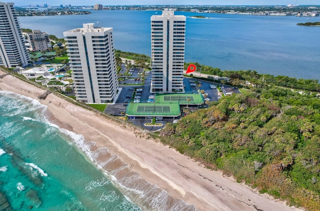 aerial view featuring a view of city, a view of the beach, and a water view