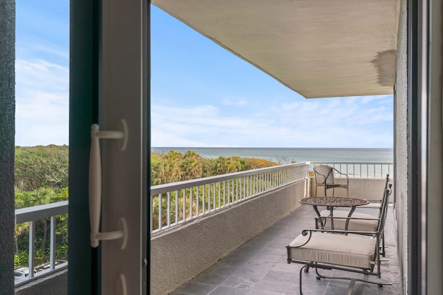 balcony featuring a water view