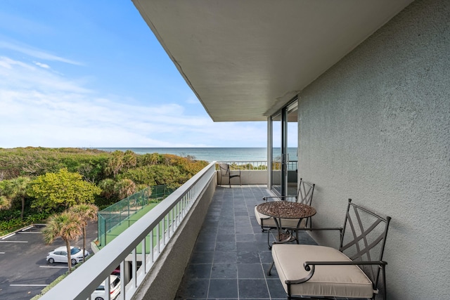 balcony featuring a water view