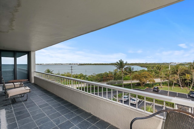 balcony featuring a water view