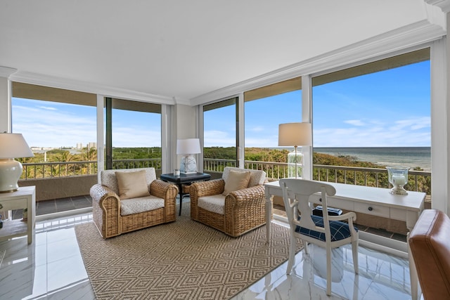 sunroom featuring a wall of windows, a water view, and plenty of natural light