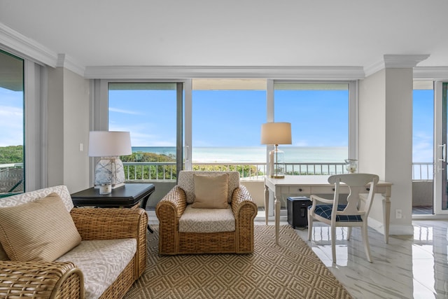 sunroom featuring baseboards, ornamental molding, and a water view
