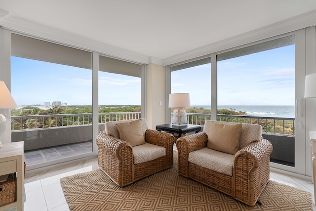 sunroom / solarium featuring a water view, tile patterned floors, and expansive windows