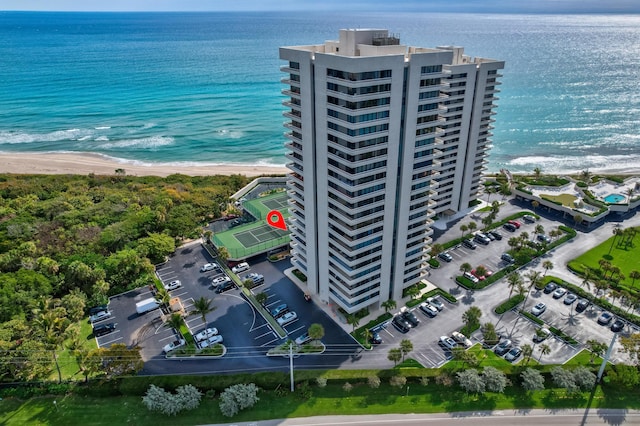 bird's eye view with a water view and a view of the beach