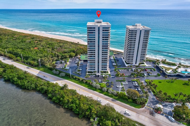 bird's eye view featuring a water view and a view of the beach
