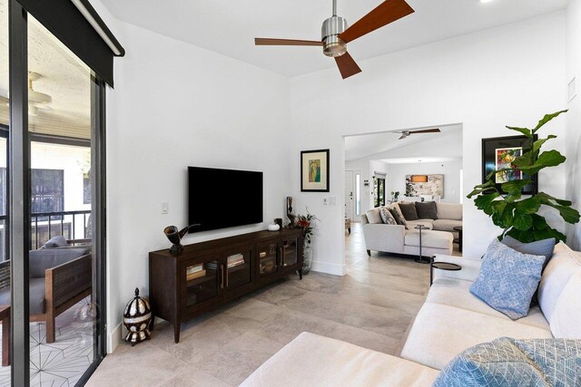 15702 Loch Maree Ln Unit 5804, Delray Beach, FL 33446 - living area featuring ceiling fan, plenty of natural light, and baseboards