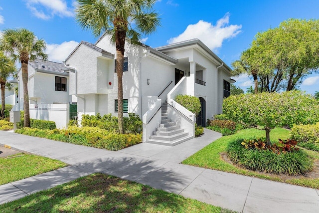 15702 Loch Maree Ln Unit 5804, Delray Beach, FL 33446 - view of front of house with stucco siding and stairs