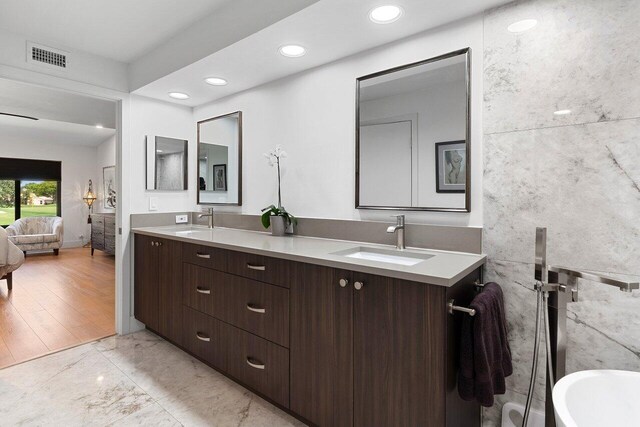15702 Loch Maree Ln Unit 5804, Delray Beach, FL 33446 - ensuite bathroom with double vanity, marble finish floors, recessed lighting, and a soaking tub