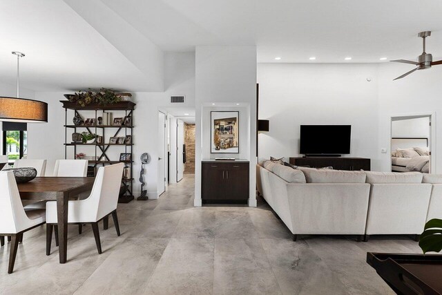 15702 Loch Maree Ln Unit 5804, Delray Beach, FL 33446 - living room with recessed lighting, finished concrete flooring, a towering ceiling, ceiling fan, and baseboards