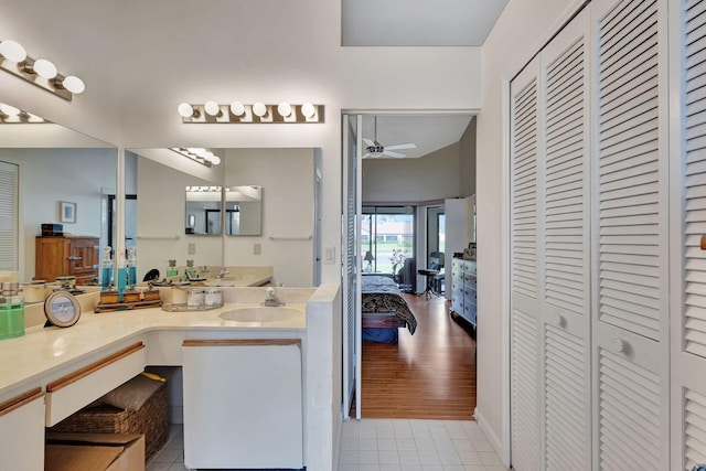 bathroom featuring a closet, ceiling fan, and tile patterned flooring
