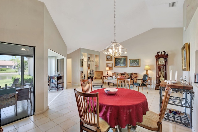 dining space featuring a chandelier, high vaulted ceiling, visible vents, and light tile patterned floors