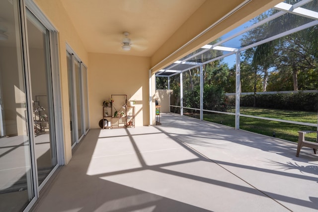 exterior space featuring a lanai and a ceiling fan
