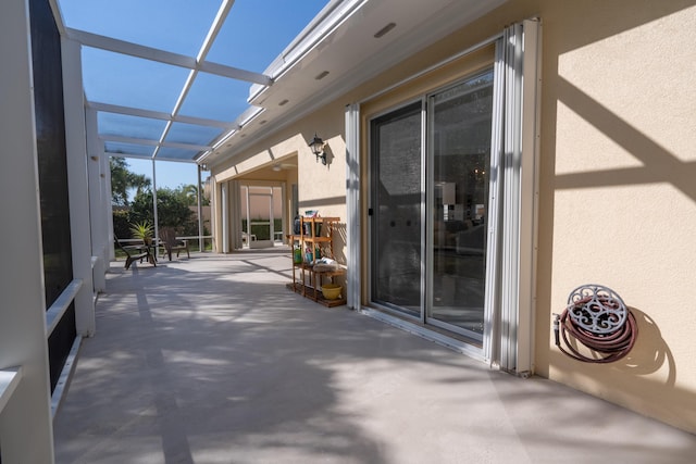 view of patio / terrace featuring glass enclosure