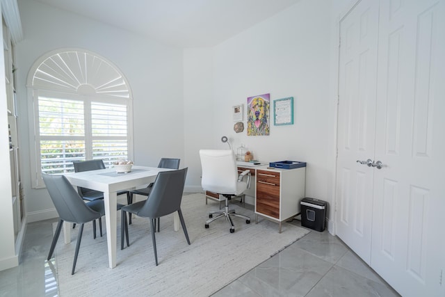office featuring marble finish floor