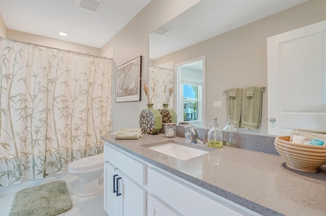 full bathroom featuring vanity, toilet, curtained shower, and visible vents