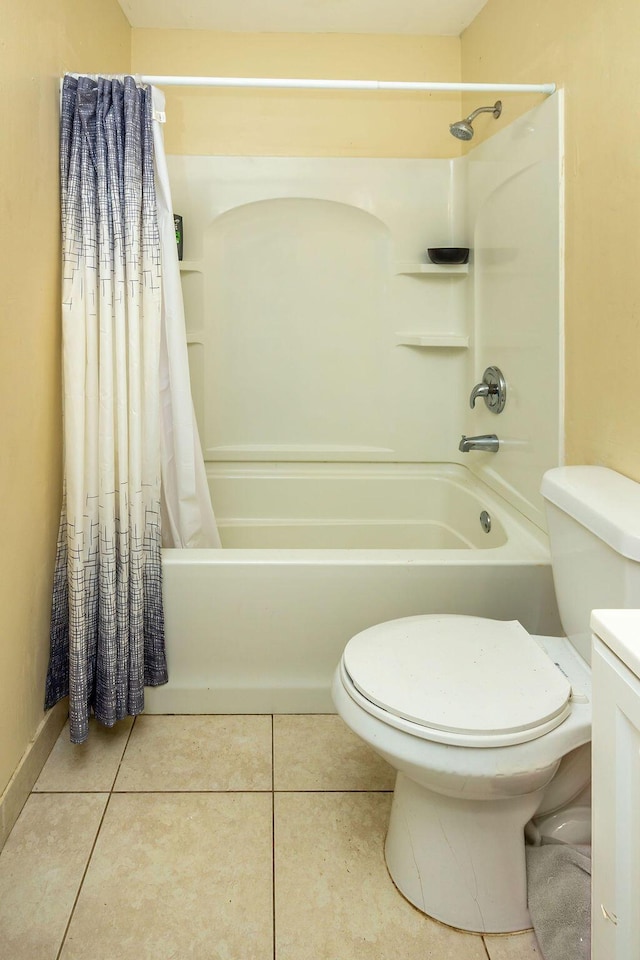 full bathroom featuring tile patterned flooring, shower / bath combination with curtain, toilet, and vanity