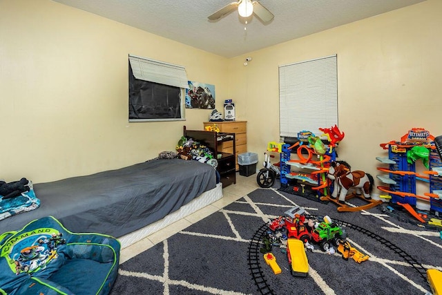 tiled bedroom with ceiling fan
