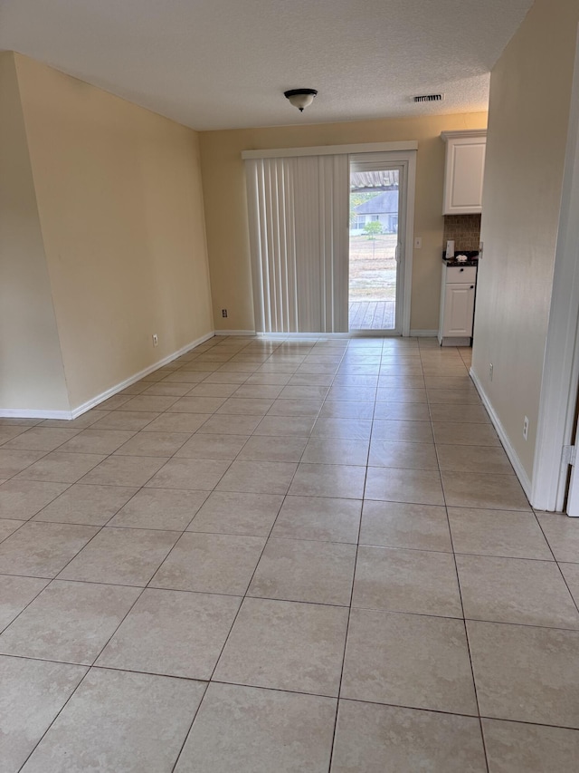 17924 W Sycamore Dr, Loxahatchee, FL 33470 - empty room with light tile patterned flooring and baseboards