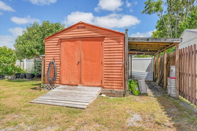 view of shed with a fenced backyard
