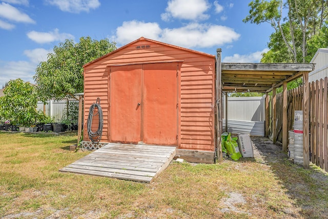 view of shed featuring a fenced backyard