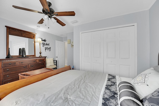 bedroom with a ceiling fan, a closet, and visible vents