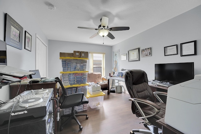 home office with ceiling fan and wood finished floors