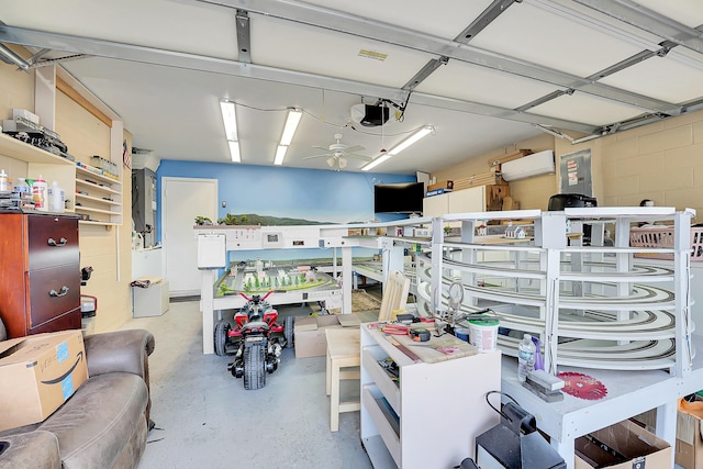 garage featuring a ceiling fan and a garage door opener