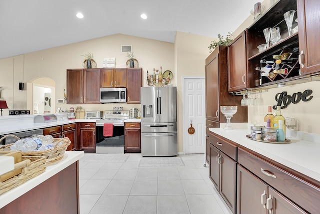 kitchen featuring light countertops, open shelves, and appliances with stainless steel finishes