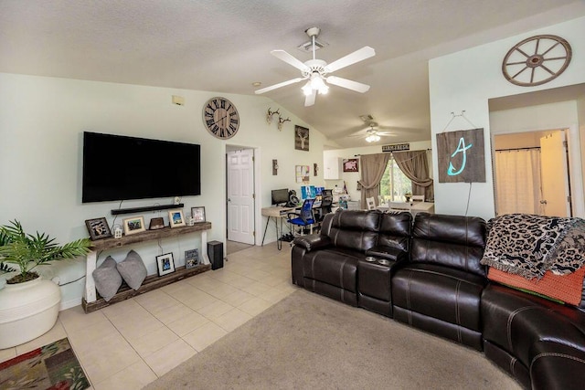 living room with baseboards, ceiling fan, tile patterned floors, and vaulted ceiling