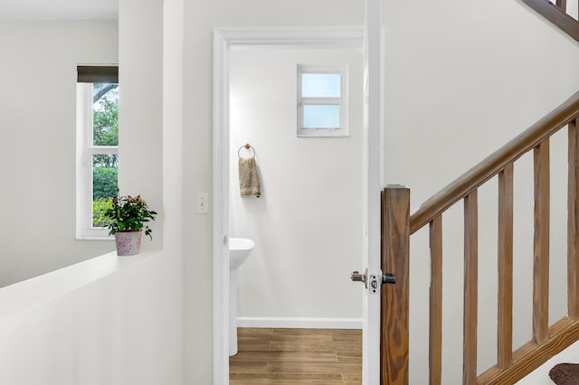21256 Via Fiore, Boca Raton, FL 33433 - staircase featuring baseboards and wood finished floors