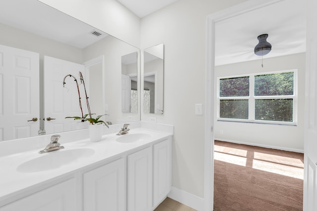 21256 Via Fiore, Boca Raton, FL 33433 - bathroom featuring double vanity and baseboards