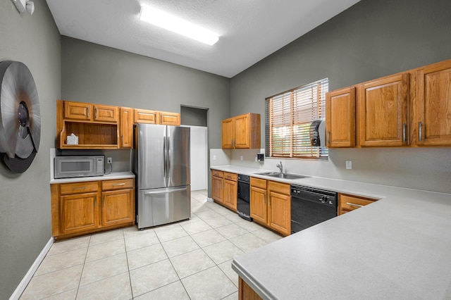 21256 Via Fiore, Boca Raton, FL 33433 - kitchen with freestanding refrigerator, dishwasher, a sink, light tile patterned floors, and light countertops