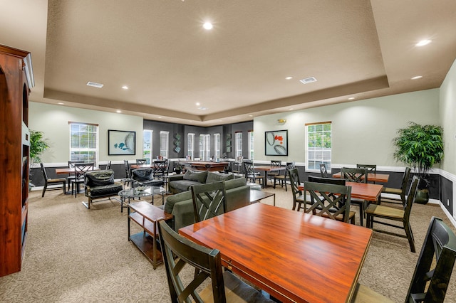 21256 Via Fiore, Boca Raton, FL 33433 - dining space with a tray ceiling, light colored carpet, and recessed lighting