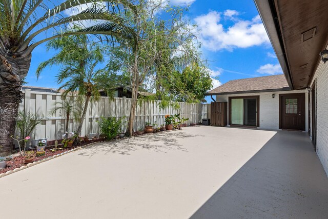 view of patio featuring fence
