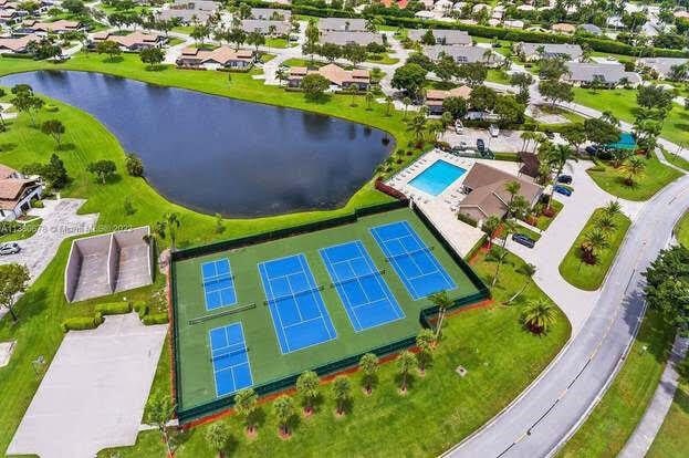 bird's eye view featuring a water view and a residential view