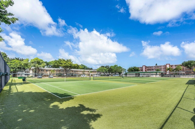 view of sport court featuring fence