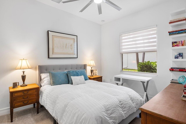 bedroom featuring baseboards, ceiling fan, and carpet