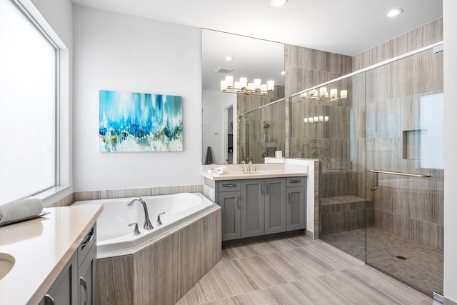 bathroom with vanity, visible vents, recessed lighting, a bath, and a stall shower