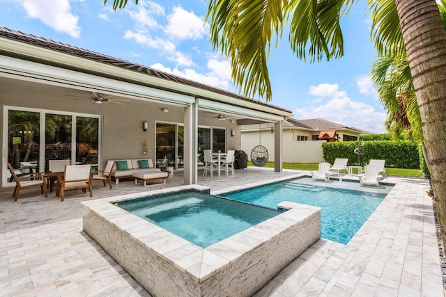 view of pool featuring outdoor lounge area, outdoor dining area, a patio, a ceiling fan, and a pool with connected hot tub