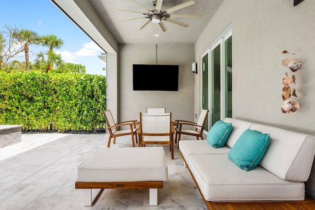 view of patio / terrace with outdoor dining area and ceiling fan