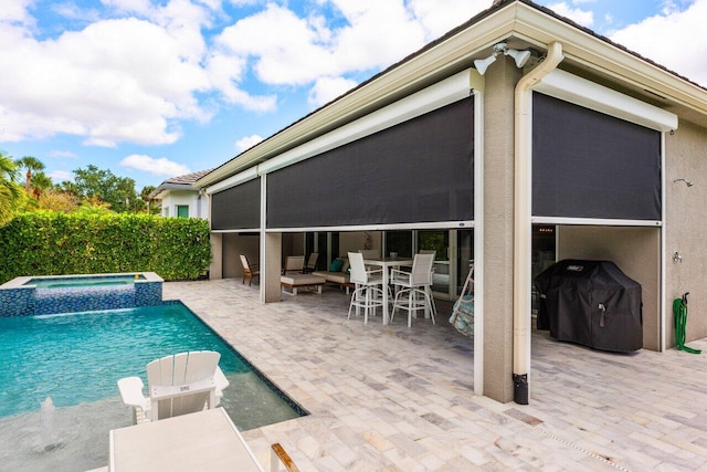 view of swimming pool featuring grilling area, a fenced in pool, outdoor dining area, an in ground hot tub, and a patio area